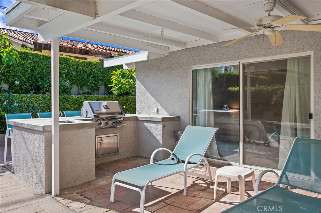 72543 Beavertail Street Palm Desert, CA 92260 - Photo 44 of 45 a patio with yard glass top table and chairs