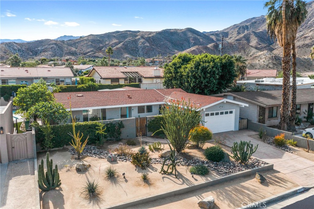72543 Beavertail Street Palm Desert, CA 92260 - Photo 45 of 45 a view of a house with a yard and a sitting area