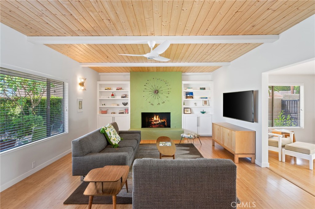 72543 Beavertail Street Palm Desert, CA 92260 - Photo 6 of 45 a living room with furniture a flat screen tv and a fireplace