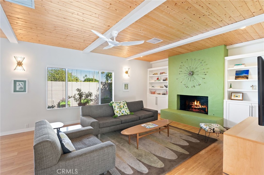 72543 Beavertail Street Palm Desert, CA 92260 - Photo 9 of 45 a living room with furniture and a fireplace