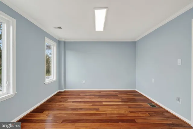 a kitchen with stainless steel appliances granite countertop wooden floors and sink