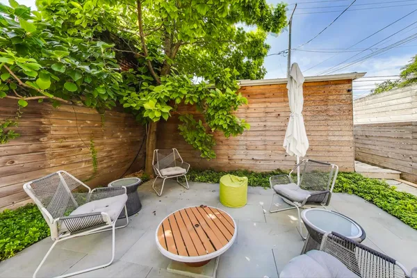 a view of an outdoor sitting area with couch and table