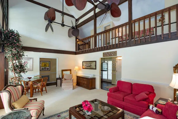 a living room with furniture rug and window
