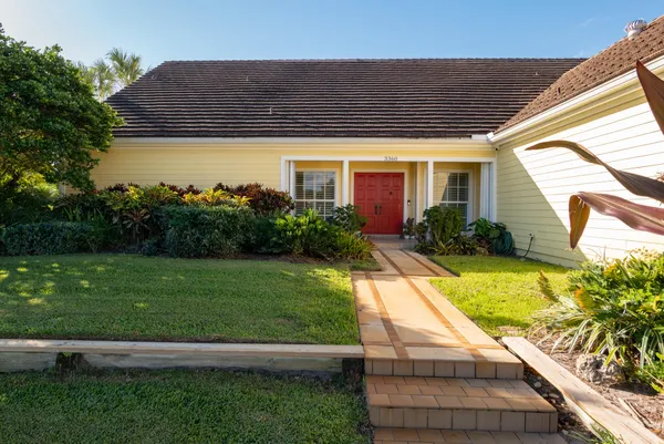 a house view with a garden space