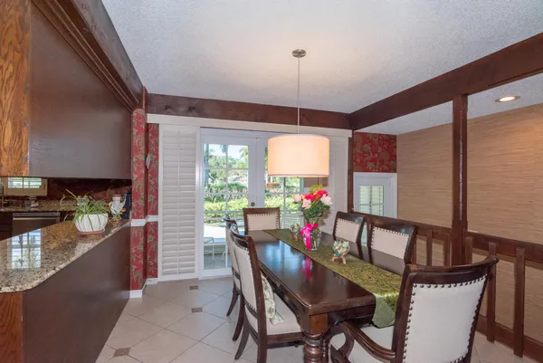 a spacious bedroom with a bed and a flat screen tv