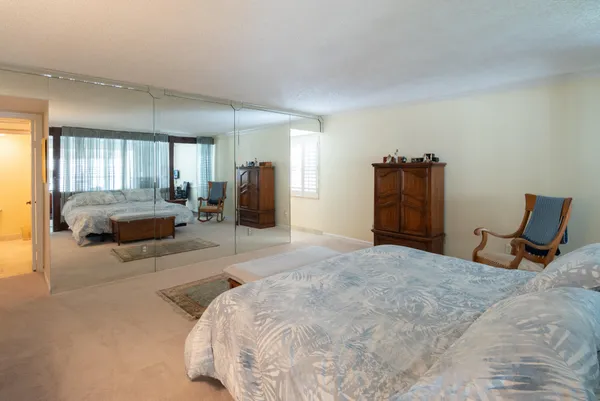 a bedroom with furniture and a window