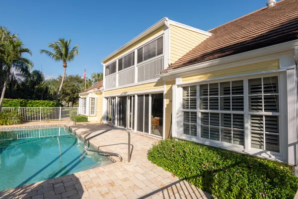 a living room with furniture stairs and a fireplace