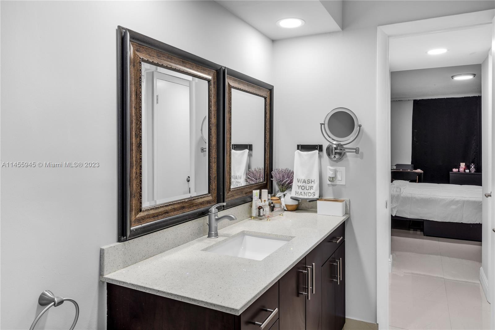 8990 Southwest 24th Street, Unit 15 Miami, FL 33165 - Photo 14 of 21 a bathroom with a sink and a mirror