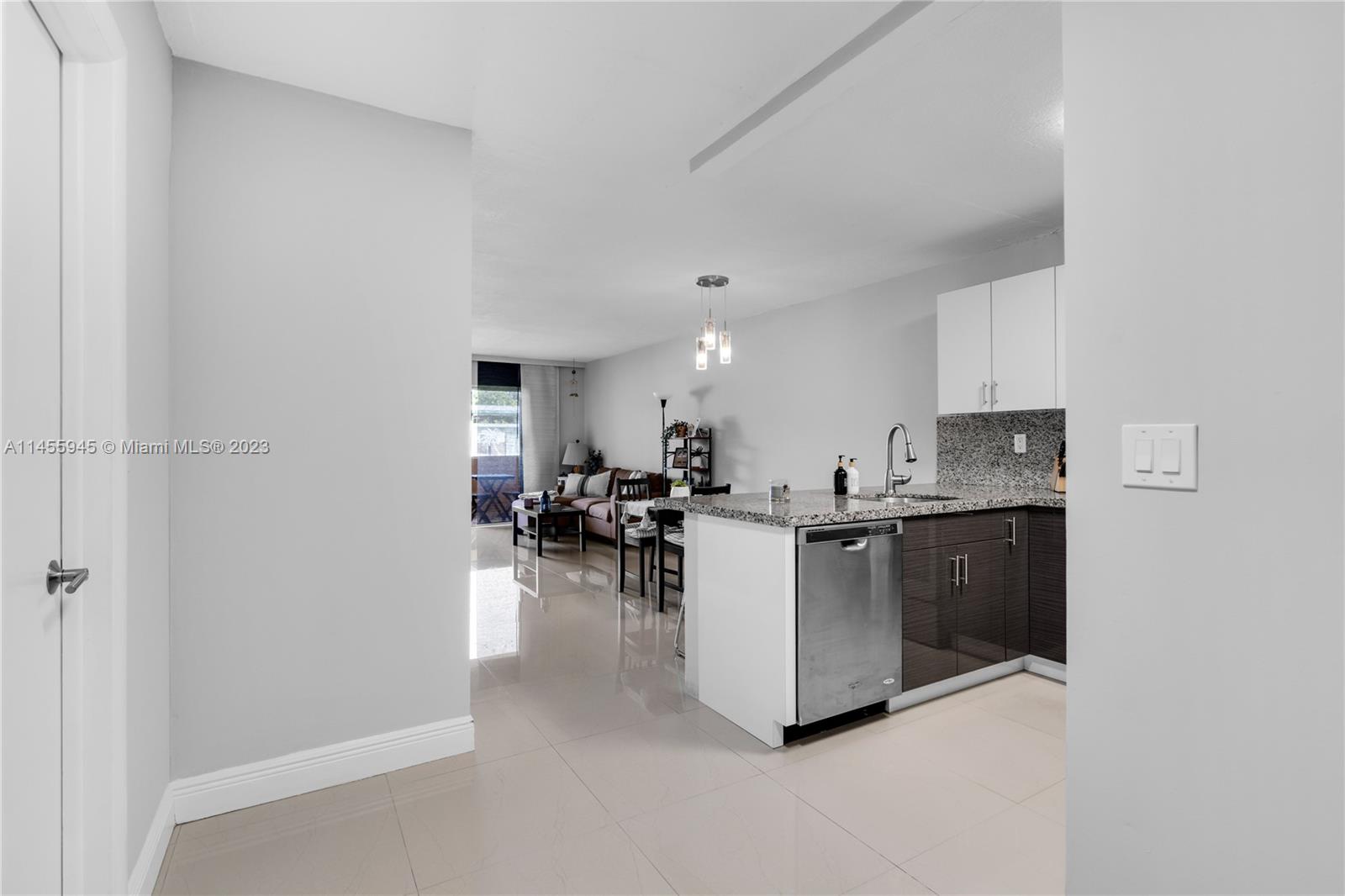 8990 Southwest 24th Street, Unit 15 Miami, FL 33165 - Photo 2 of 21 a living room with furniture a view and a workspace