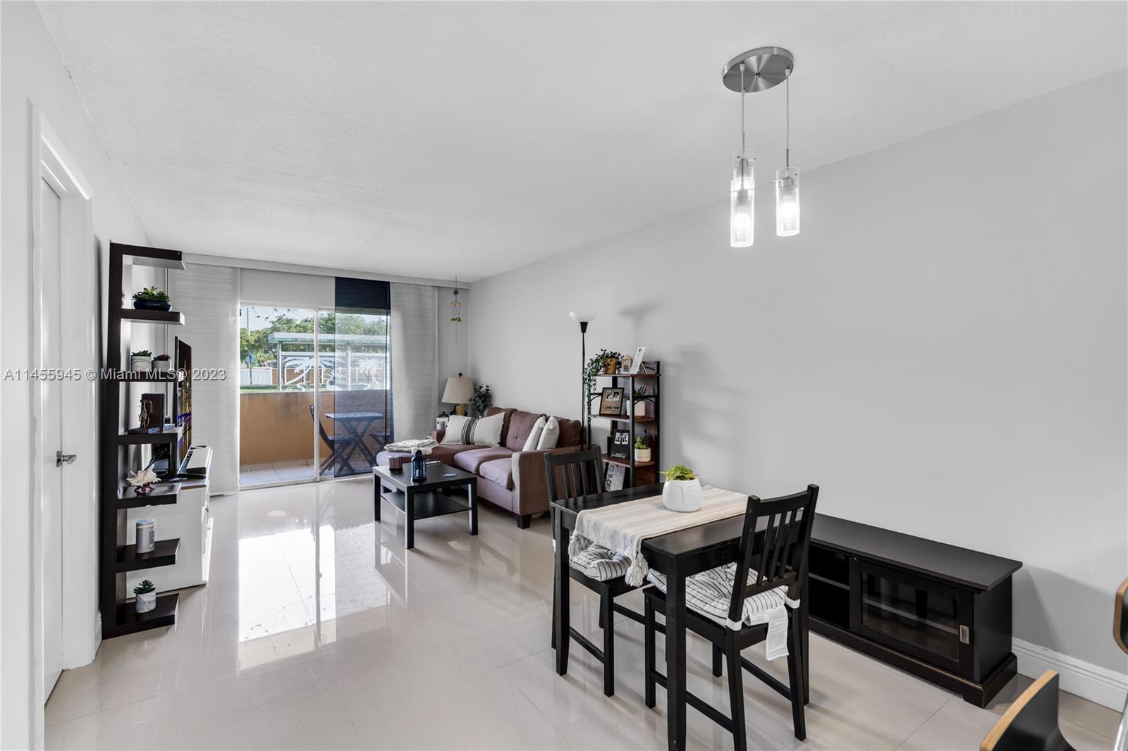 8990 Southwest 24th Street, Unit 15 Miami, FL 33165 - Photo 6 of 21 a view of a livingroom and dining room