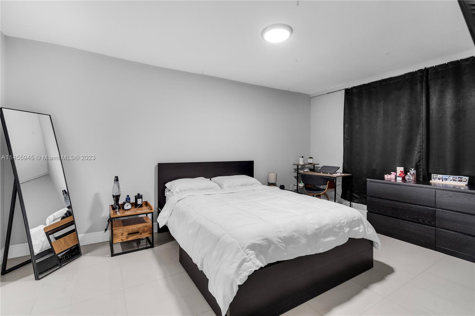 8990 Southwest 24th Street, Unit 15 Miami, FL 33165 - Photo 10 of 21 a bedroom with bed and a couch