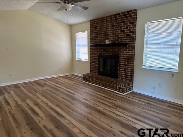 2100 Faulkner Street Tyler, TX 75701 - Photo 3 of 9 a view of an empty room with a fireplace and a window