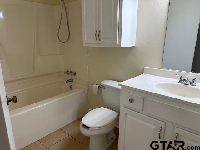 2100 Faulkner Street Tyler, TX 75701 - Photo 6 of 9 a bathroom with a sink a toilet and shower