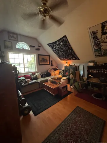 a bed room with furniture and a fireplace