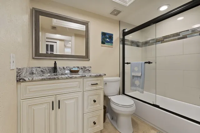 a spacious bedroom with a bed and a window