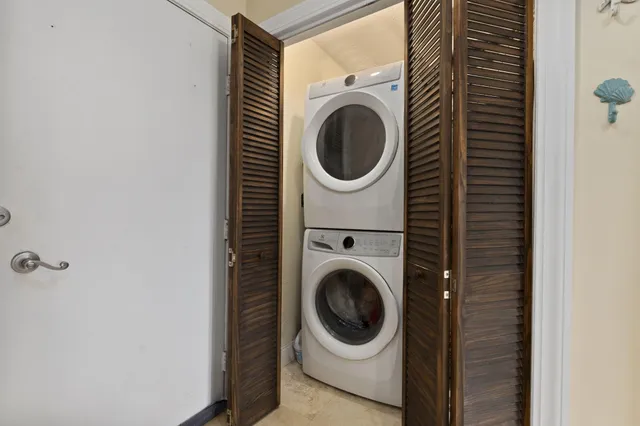 a living room with furniture a rug and a large window