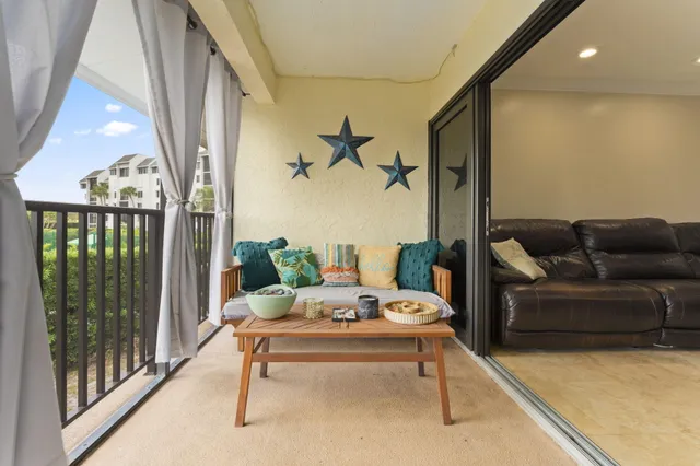 a view of a swimming pool with a table and chairs