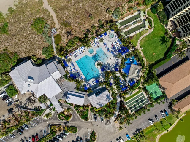 a swimming pool with outdoor seating and yard
