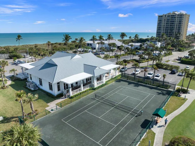 a dining room with furniture and chandelier