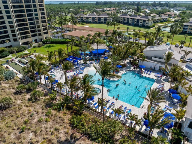 a view of a house with backyard sitting area and garden