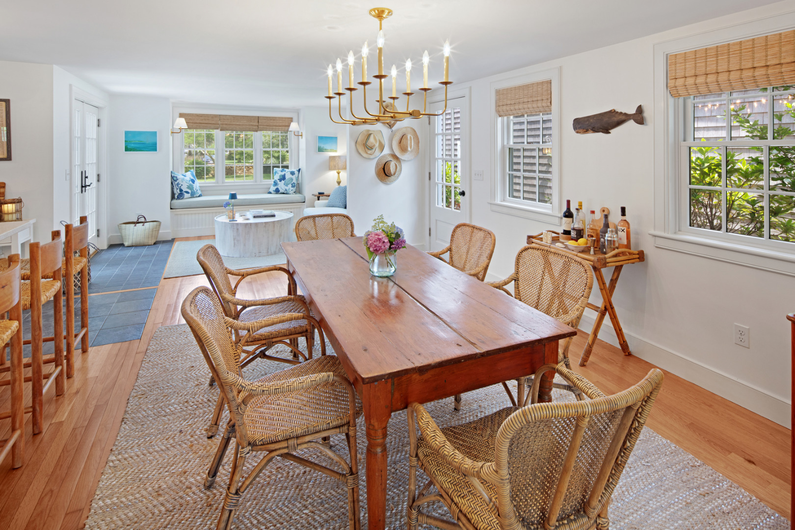5 Hillman Drive Edgartown, MA 02539 - Photo 11 of 34 a view of a dining room with furniture a chandelier and wooden floor