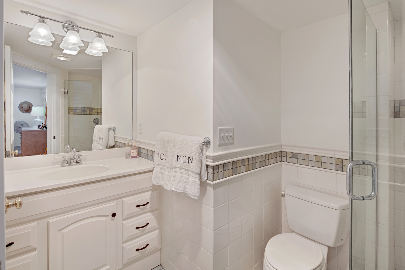 5 Hillman Drive Edgartown, MA 02539 - Photo 17 of 34 a bathroom with a sink toilet vanity and shower