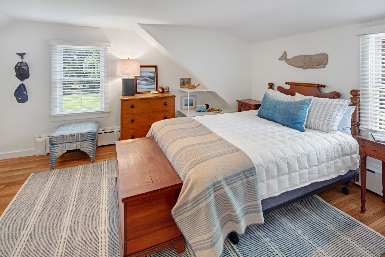 5 Hillman Drive Edgartown, MA 02539 - Photo 25 of 34 a bedroom with a bed and wooden floor