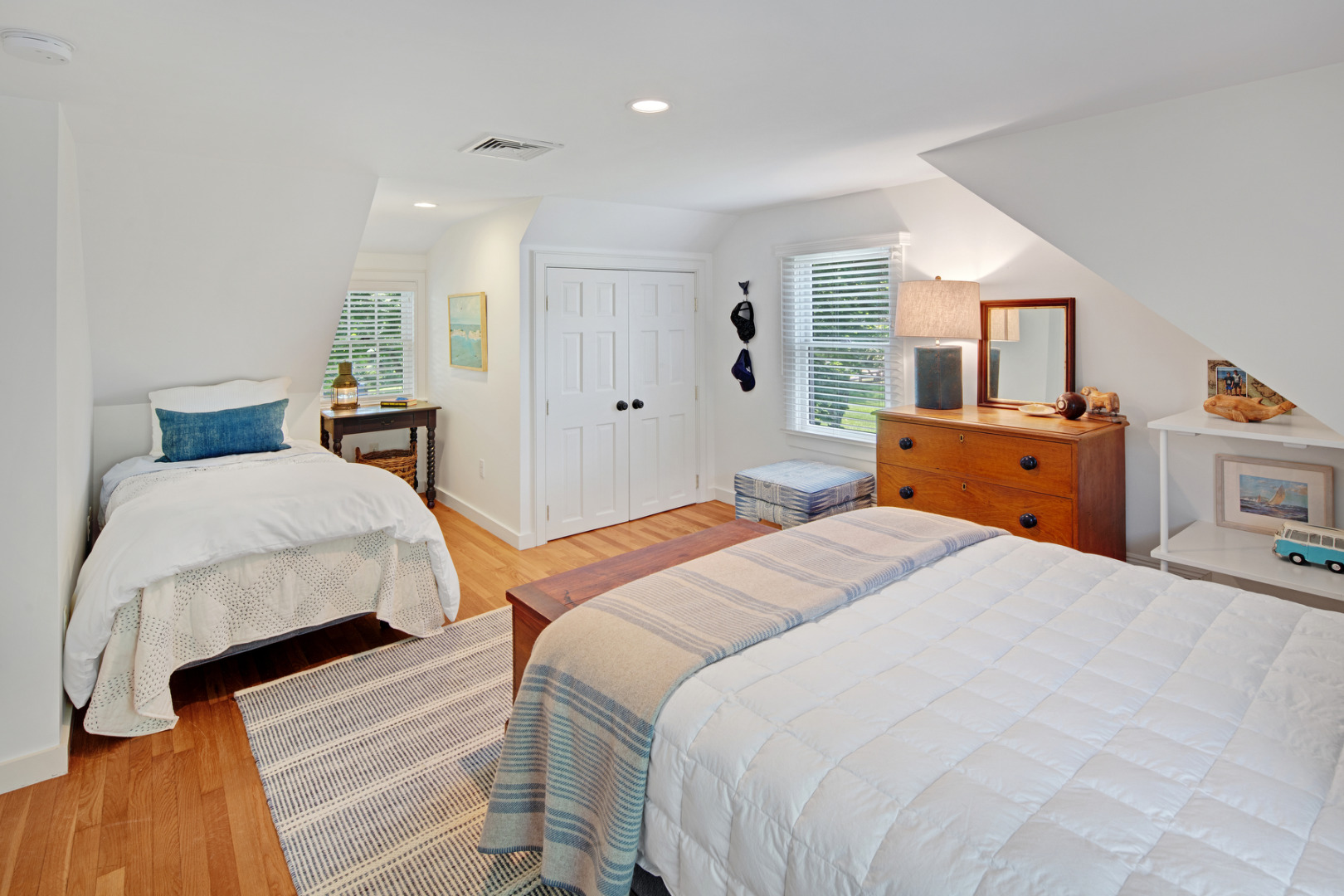 5 Hillman Drive Edgartown, MA 02539 - Photo 26 of 34 a bedroom with a bed and wooden floor