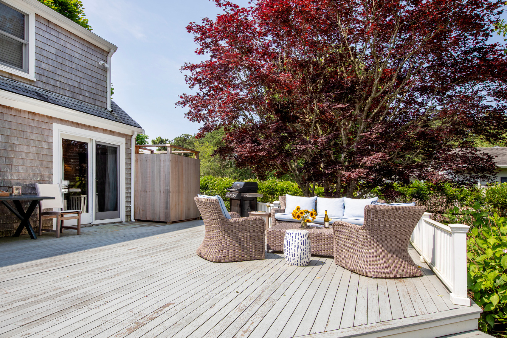 5 Hillman Drive Edgartown, MA 02539 - Photo 32 of 34 a view of a patio with table and chairs and wooden floor