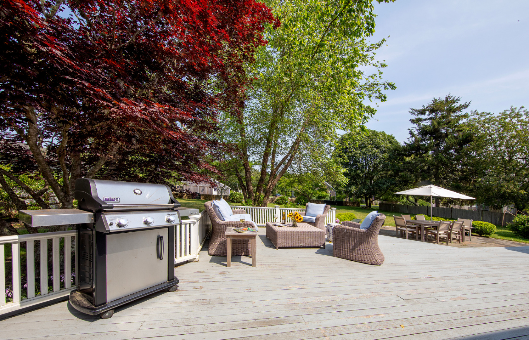 5 Hillman Drive Edgartown, MA 02539 - Photo 33 of 34 a view of a patio with table and chairs barbeque potted plants and large tree