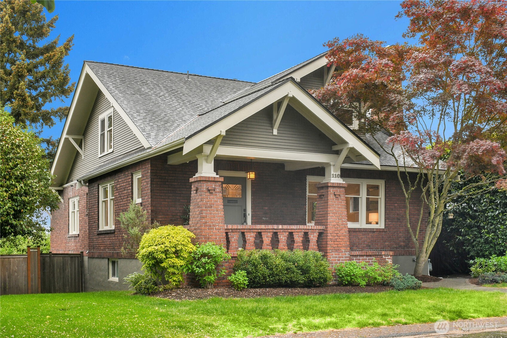 110 Smith Street Seattle, WA 98109 - Photo 1 of 35 a front view of a house with garden