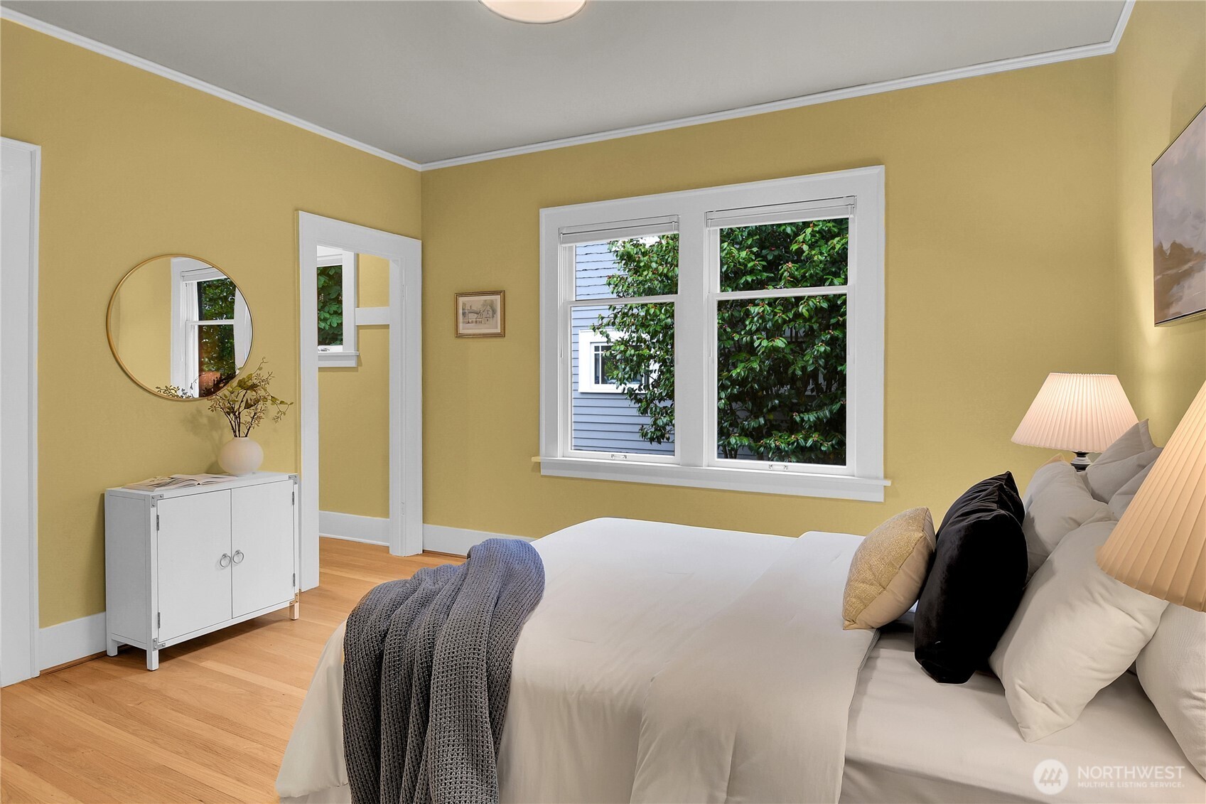 110 Smith Street Seattle, WA 98109 - Photo 14 of 35 a bedroom with a bed and a window