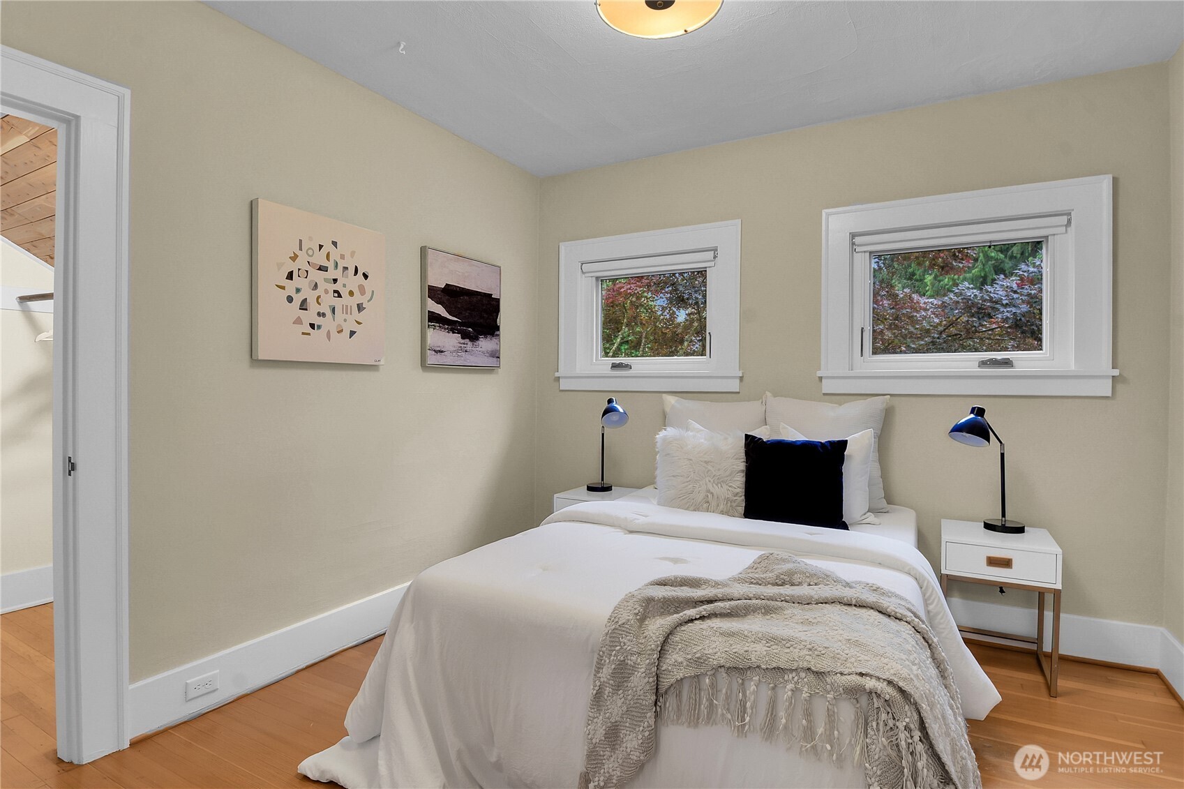 110 Smith Street Seattle, WA 98109 - Photo 17 of 35 a bedroom with a bed and a wall painting
