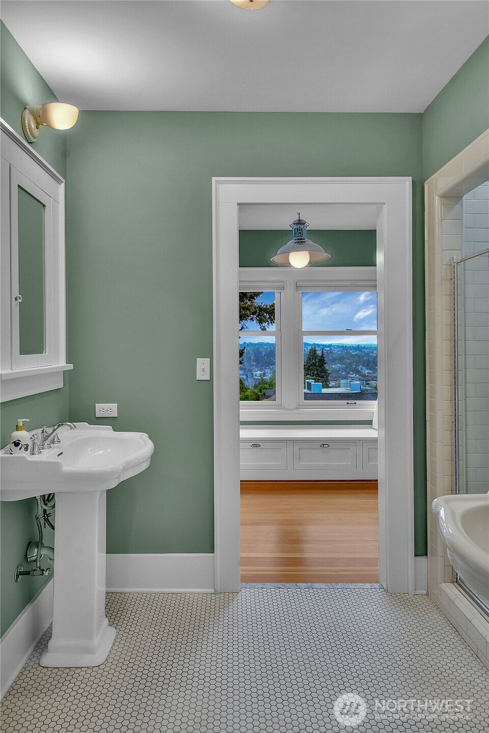 110 Smith Street Seattle, WA 98109 - Photo 21 of 35 a bathroom with a sink and a mirror