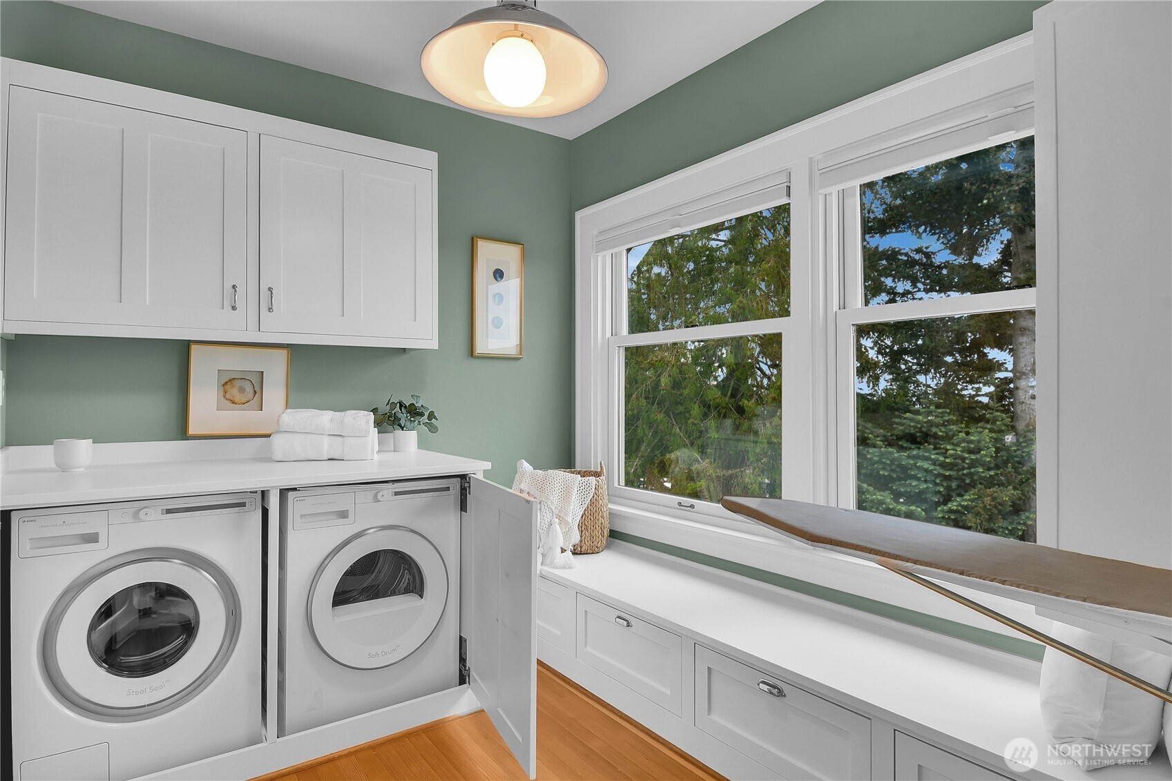 110 Smith Street Seattle, WA 98109 - Photo 22 of 35 a view of storage and utility room with washer and dryer