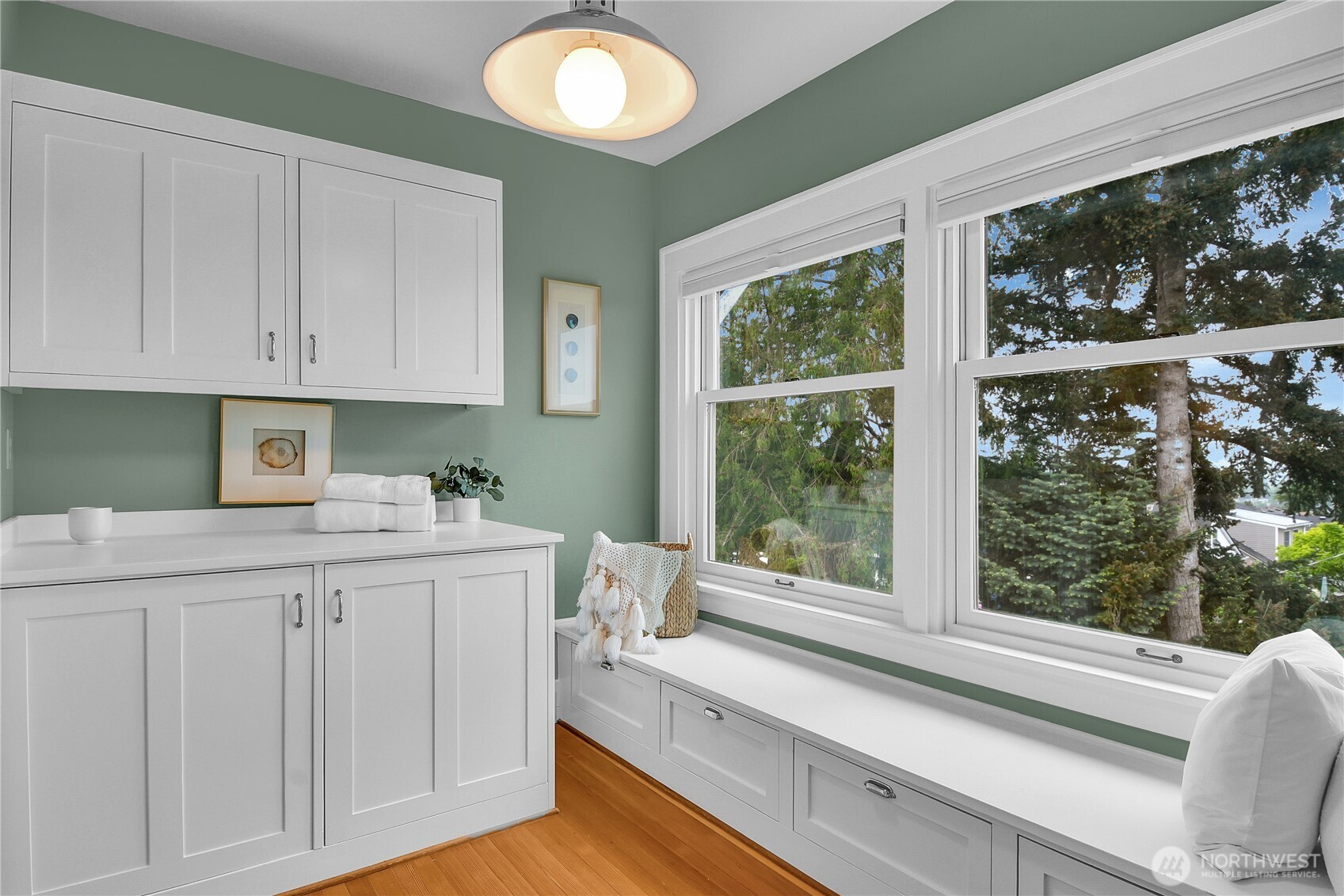 110 Smith Street Seattle, WA 98109 - Photo 23 of 35 a kitchen with granite countertop a sink and white cabinets