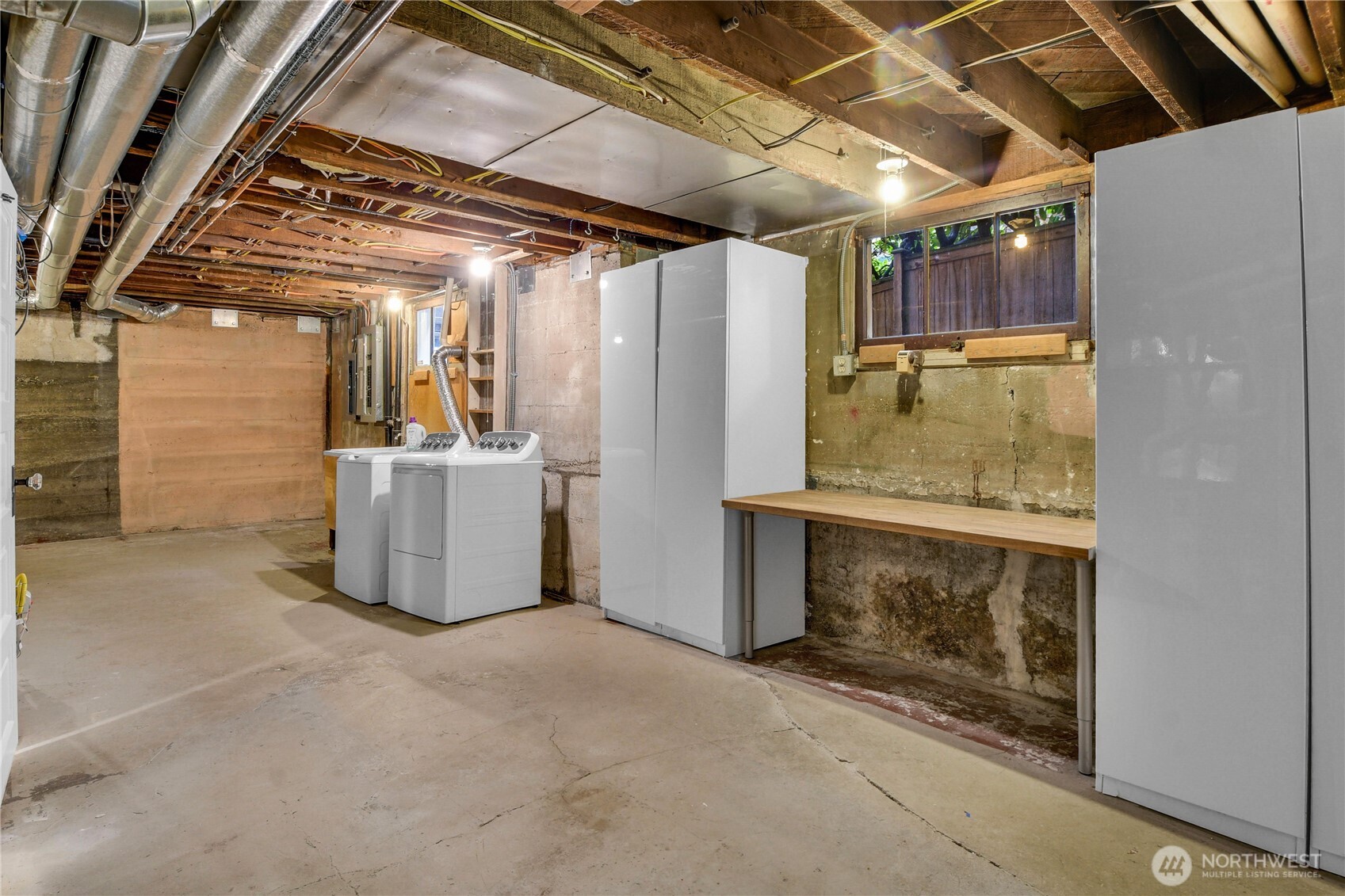110 Smith Street Seattle, WA 98109 - Photo 28 of 35 a utility room with dryer and washer