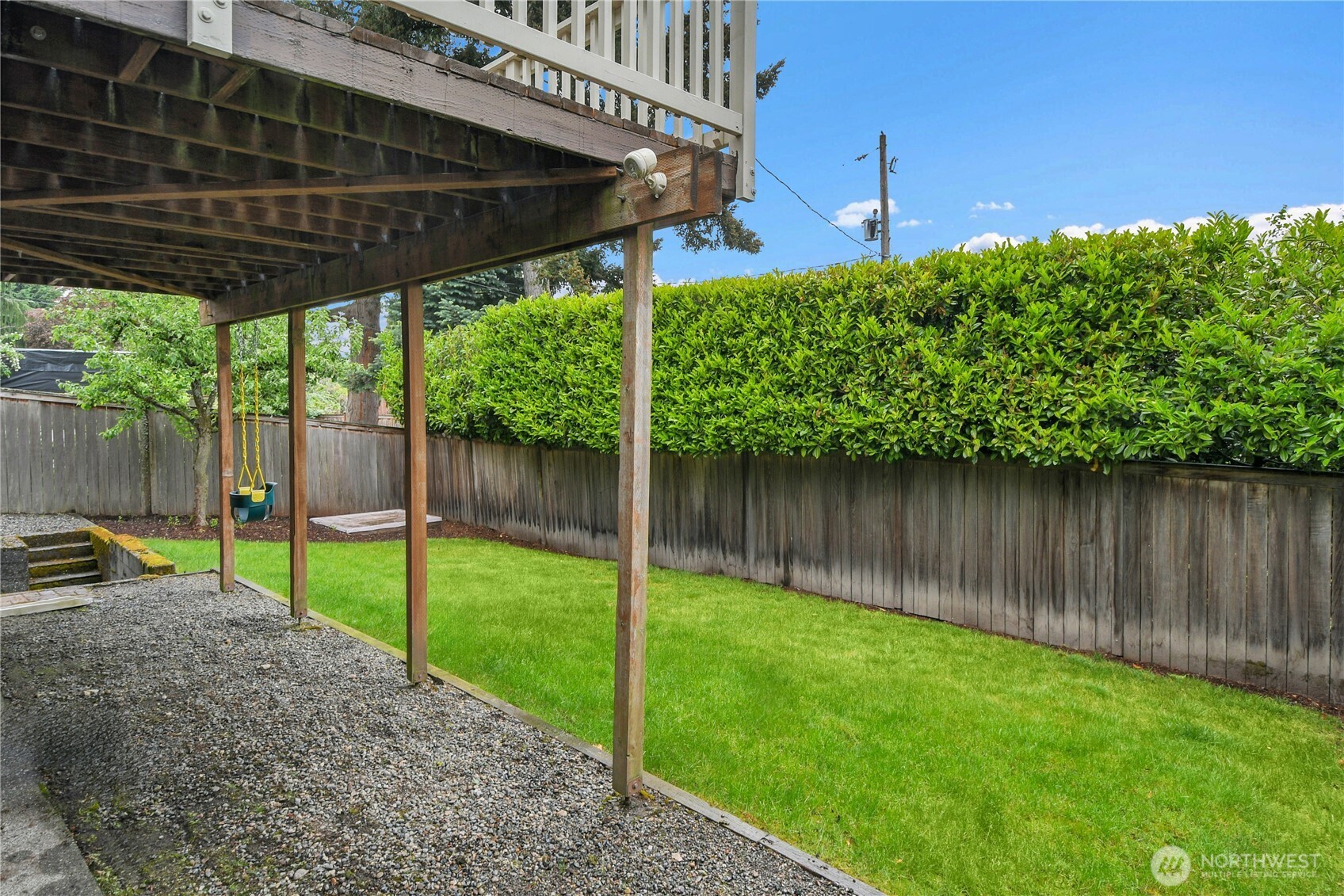 110 Smith Street Seattle, WA 98109 - Photo 32 of 35 a backyard of a house with plants and outdoor seating