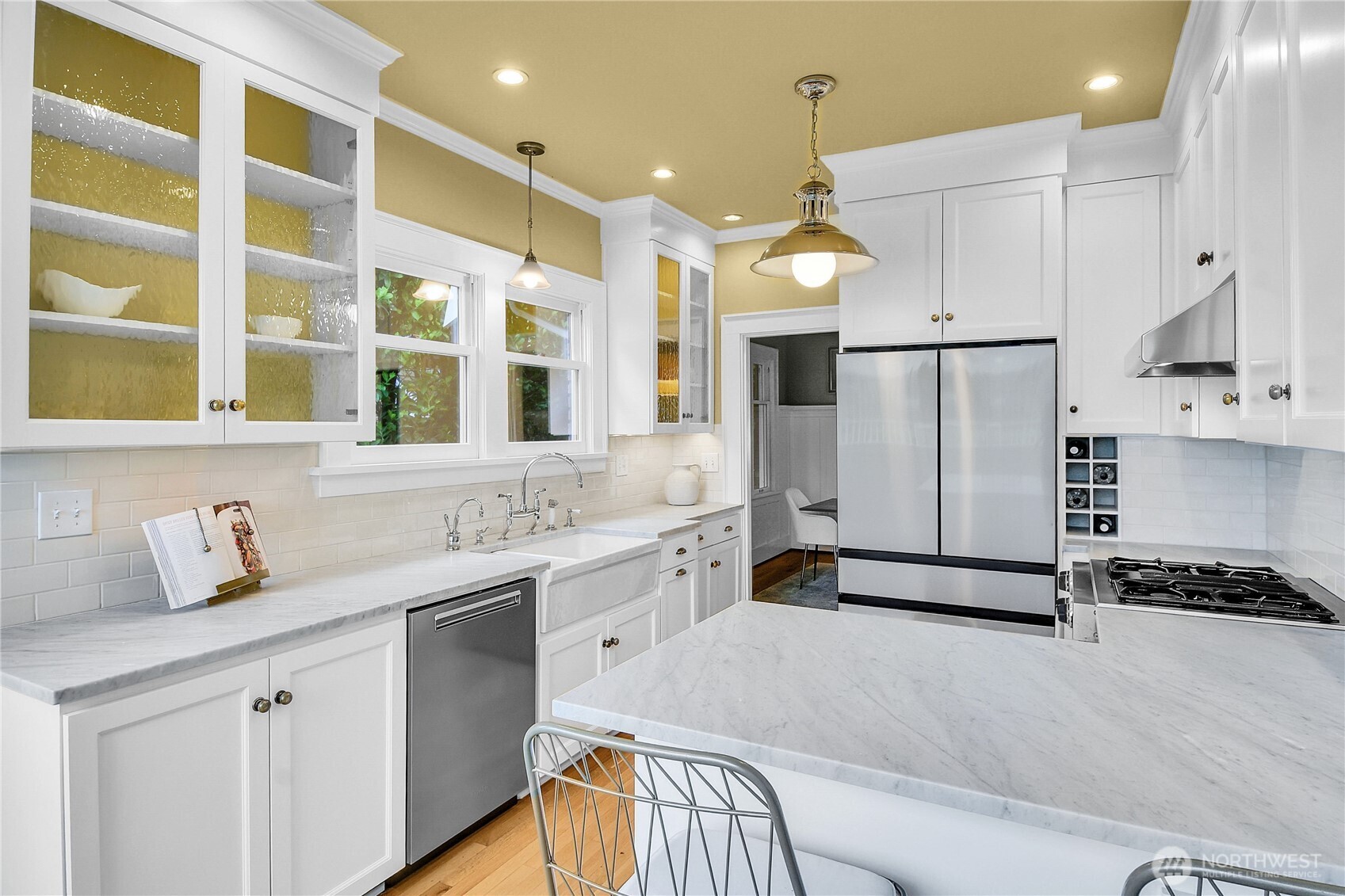 110 Smith Street Seattle, WA 98109 - Photo 9 of 35 a kitchen with a sink appliances and cabinets