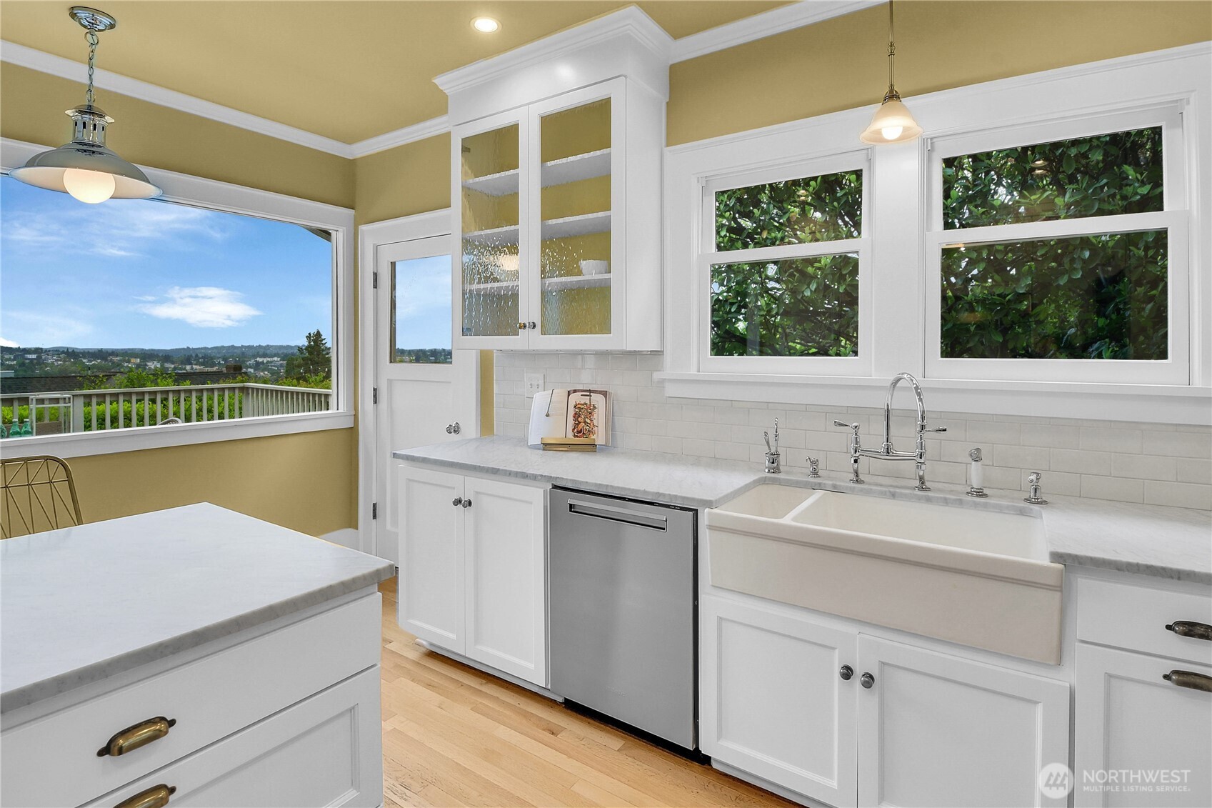 110 Smith Street Seattle, WA 98109 - Photo 10 of 35 a kitchen with a sink window and cabinets