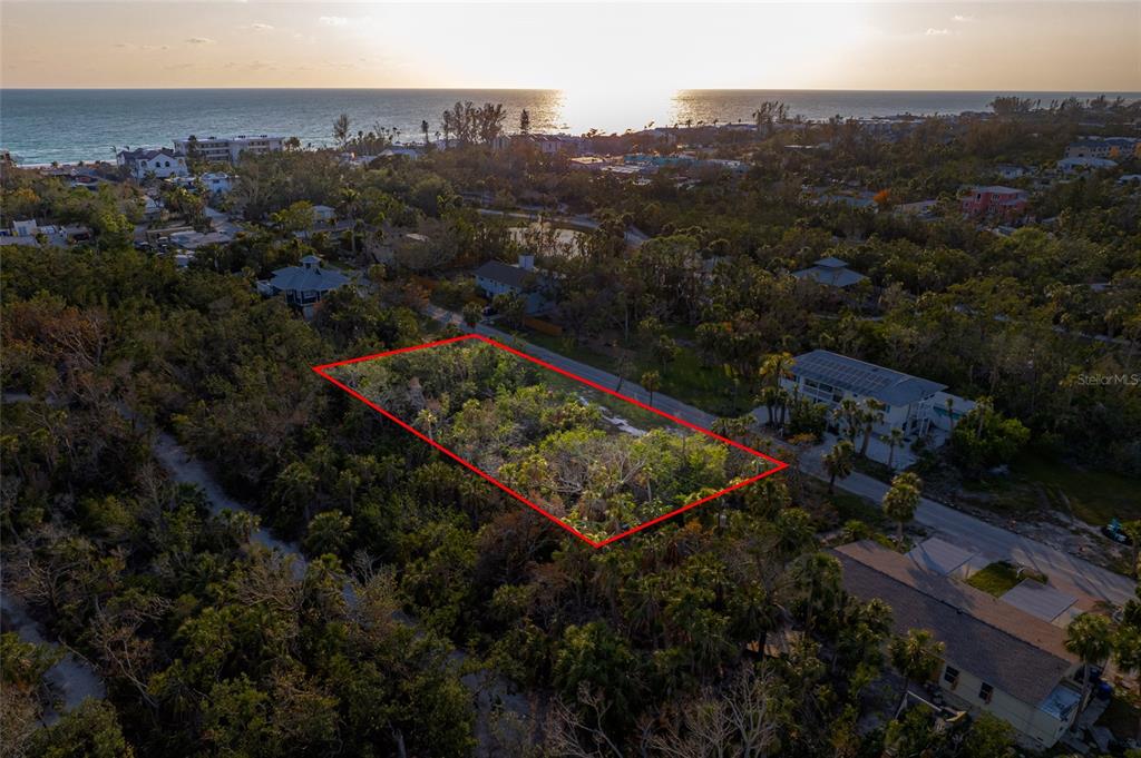 560 Gulf Bay Road Longboat Key, FL 34228 - Photo 1 of 38 an aerial view of residential house with outdoor space and garden