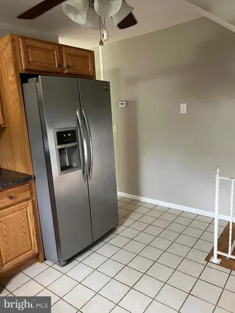 a view of a refrigerator in kitchen and a refrigerator