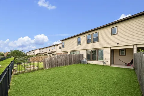a view of a house with a yard and sitting area