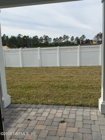 a bathroom with a sink mirror and vanity