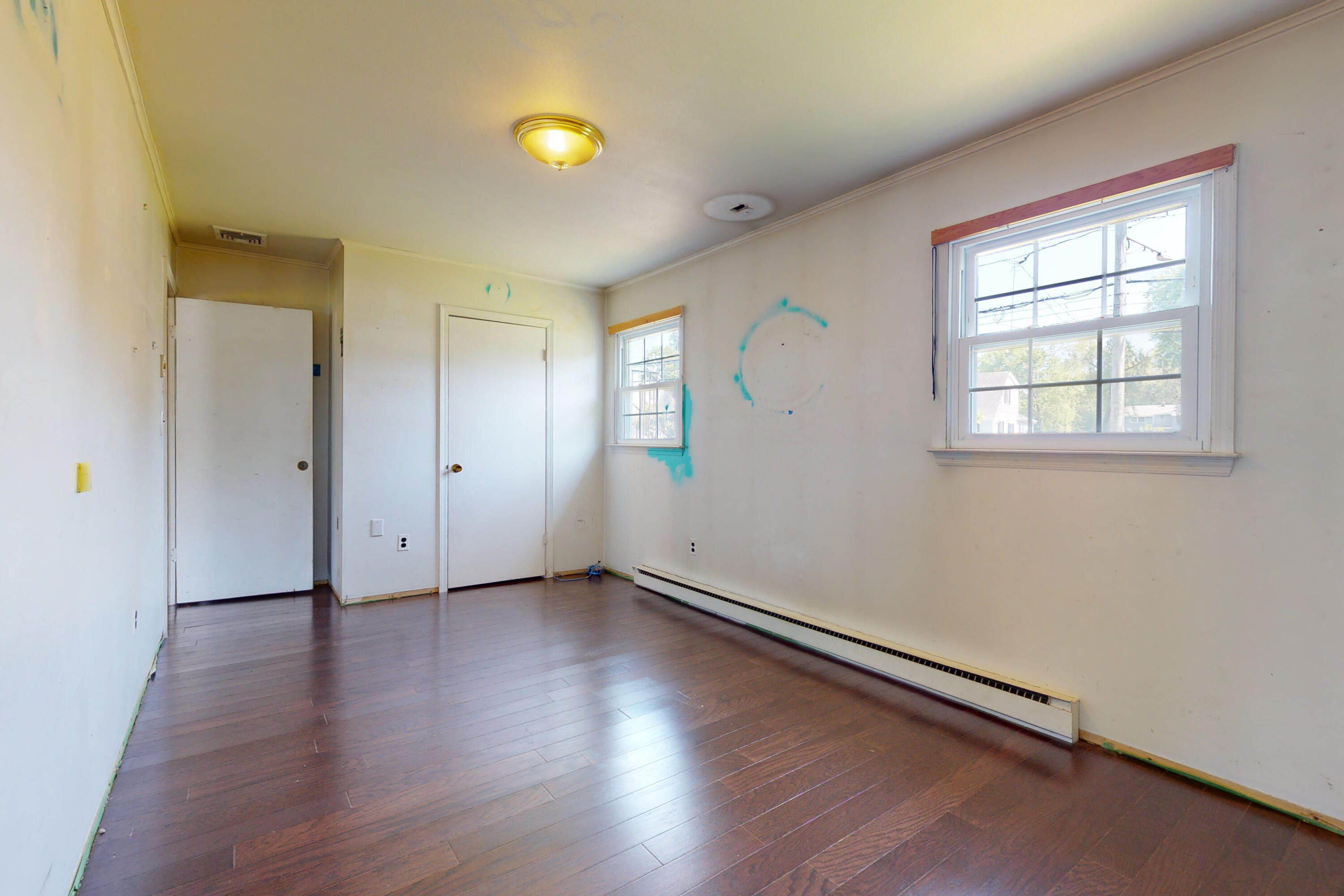 47 Mitchell Street Stamford, CT 06902 - Photo 16 of 22 an empty room with wooden floor and windows