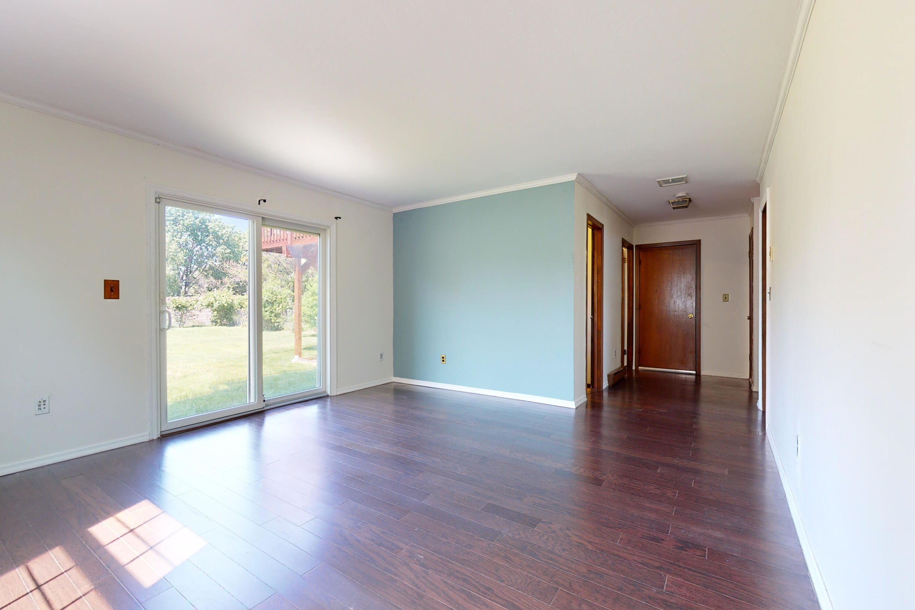 47 Mitchell Street Stamford, CT 06902 - Photo 18 of 22 a view of an empty room with wooden floor and a window