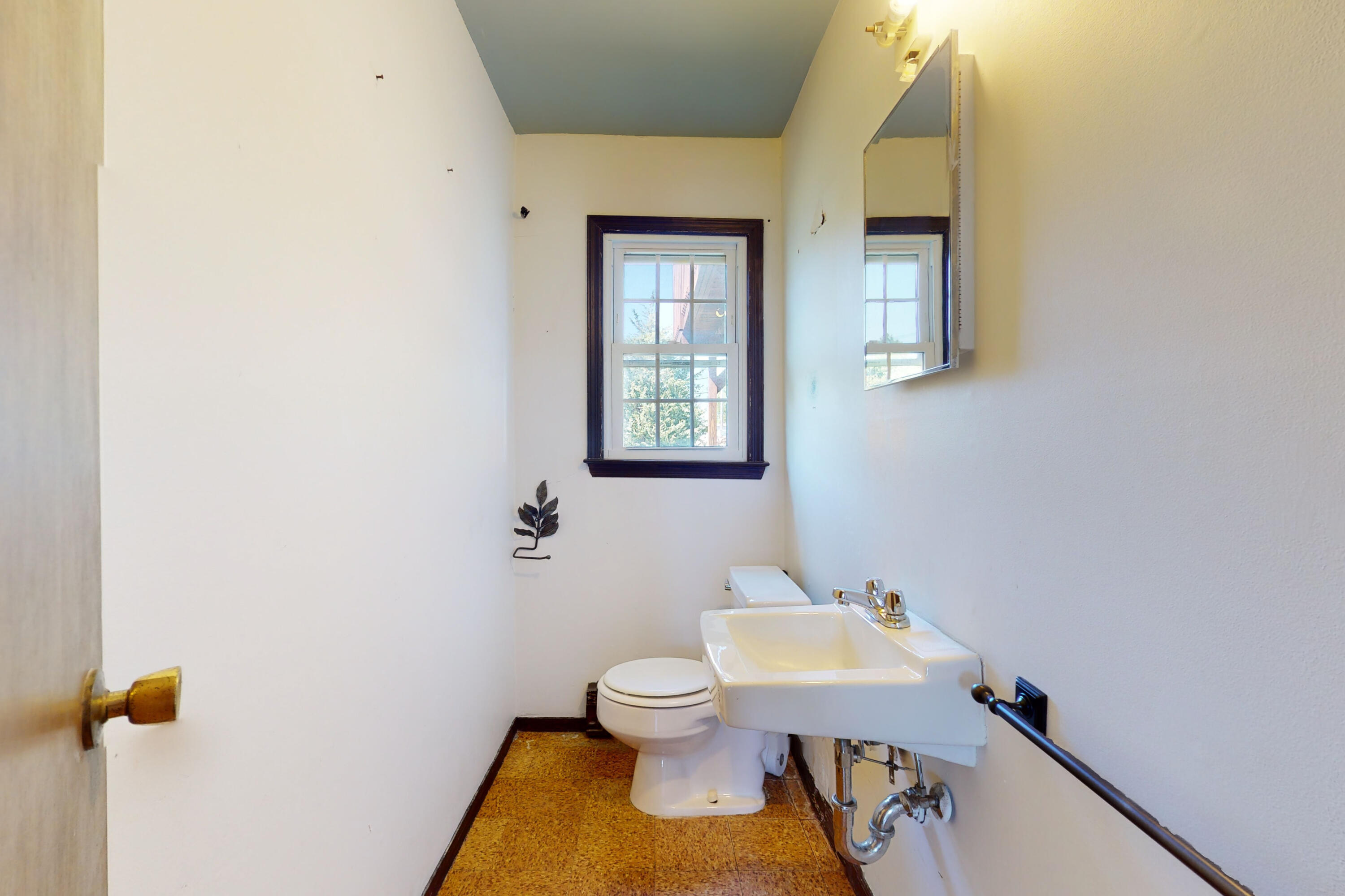 47 Mitchell Street Stamford, CT 06902 - Photo 19 of 22 a bathroom with a toilet a sink and mirror