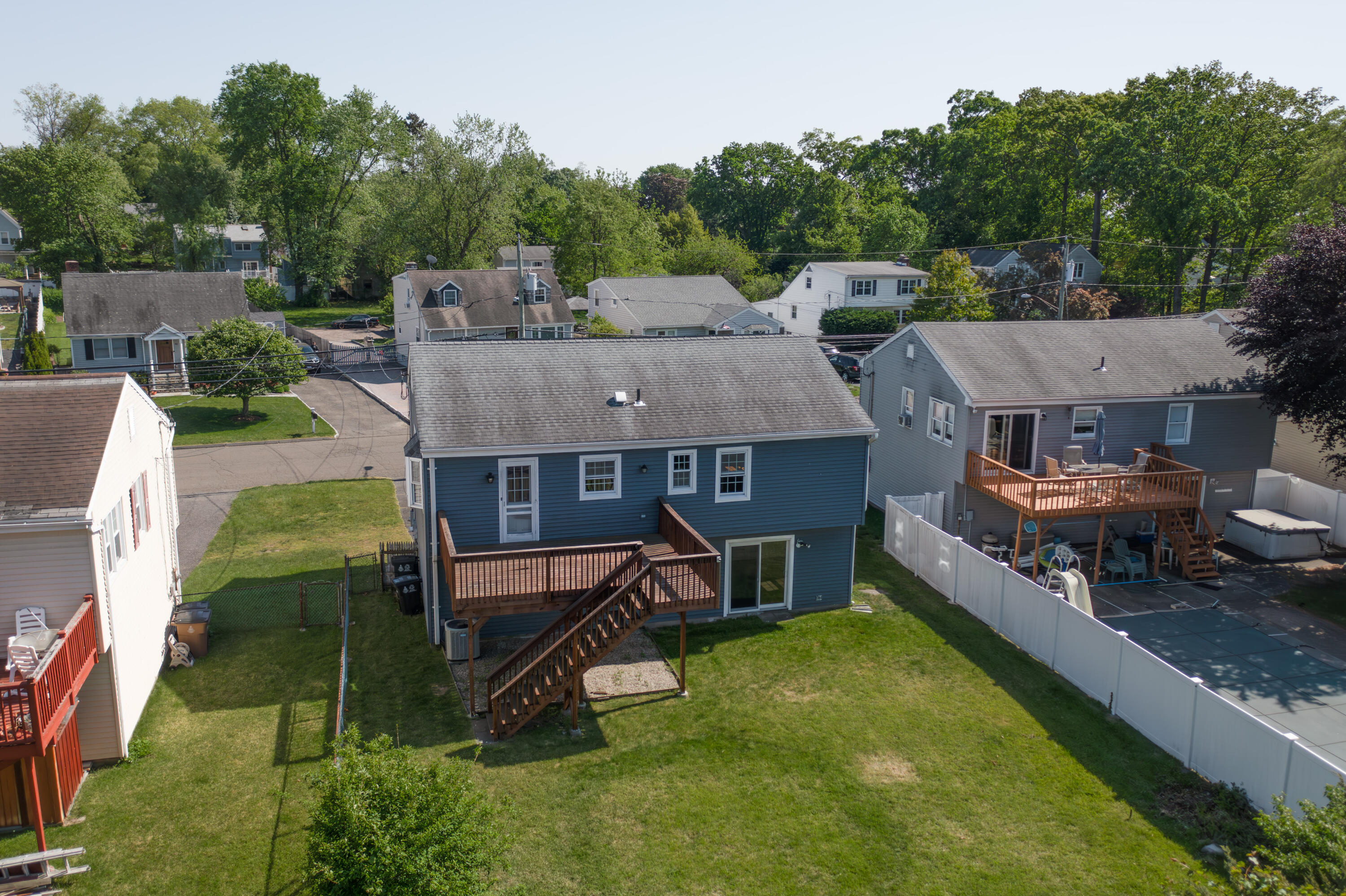 47 Mitchell Street Stamford, CT 06902 - Photo 21 of 22 an aerial view of a house with swimming pool and a yard