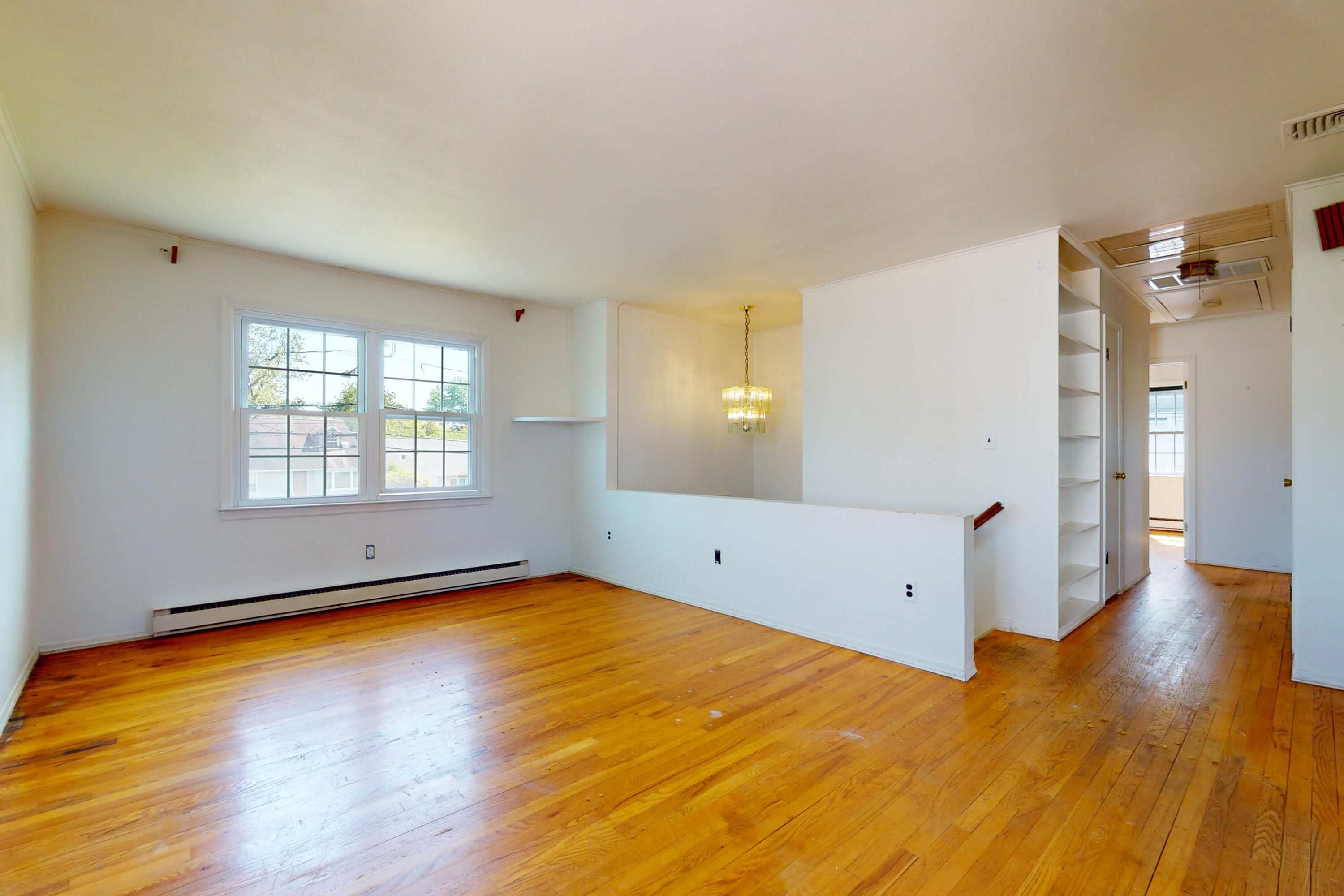 47 Mitchell Street Stamford, CT 06902 - Photo 3 of 22 a view of a room with wooden floor and windows