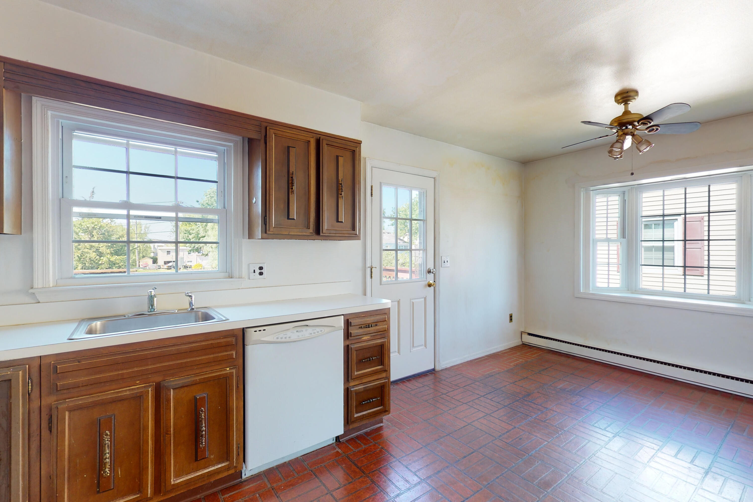 47 Mitchell Street Stamford, CT 06902 - Photo 6 of 22 a kitchen with stainless steel appliances granite countertop a sink a stove cabinets and wooden floor